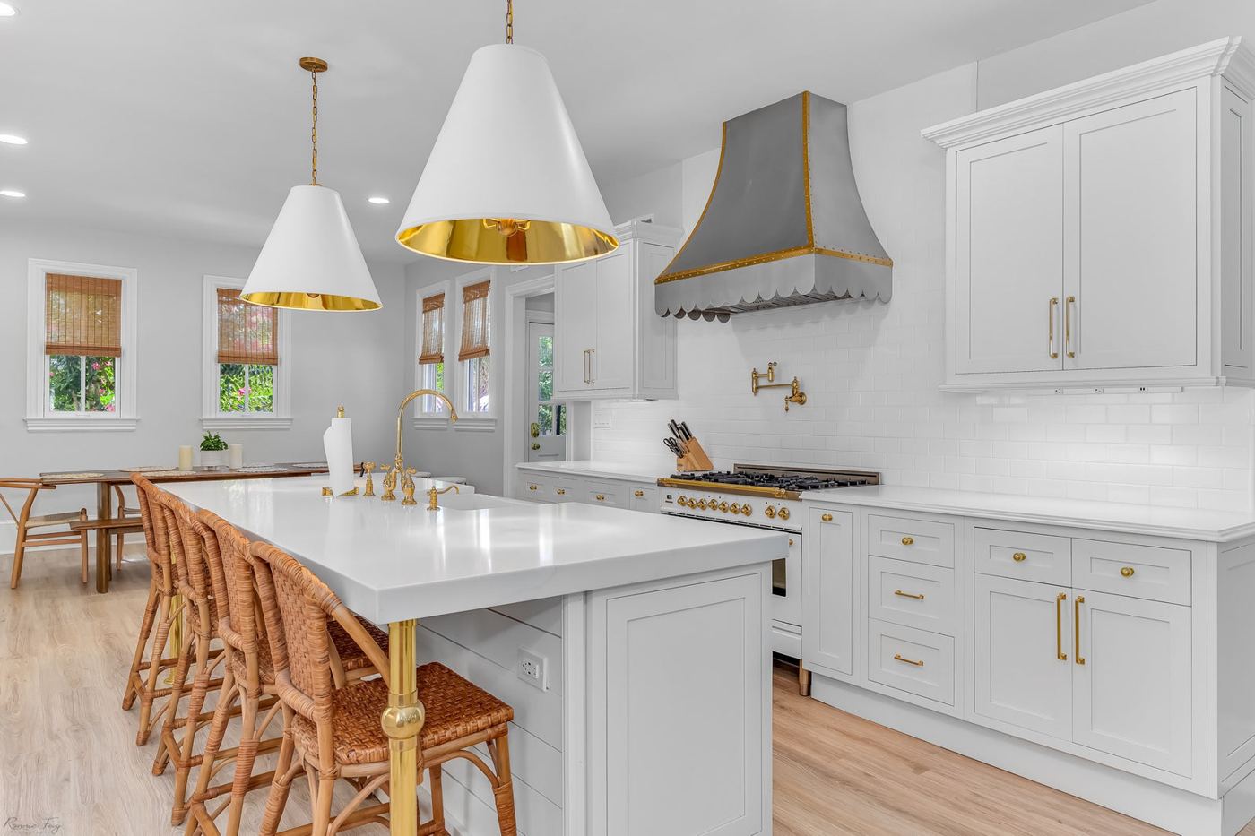White inset kitchen with island and gold pendant lights